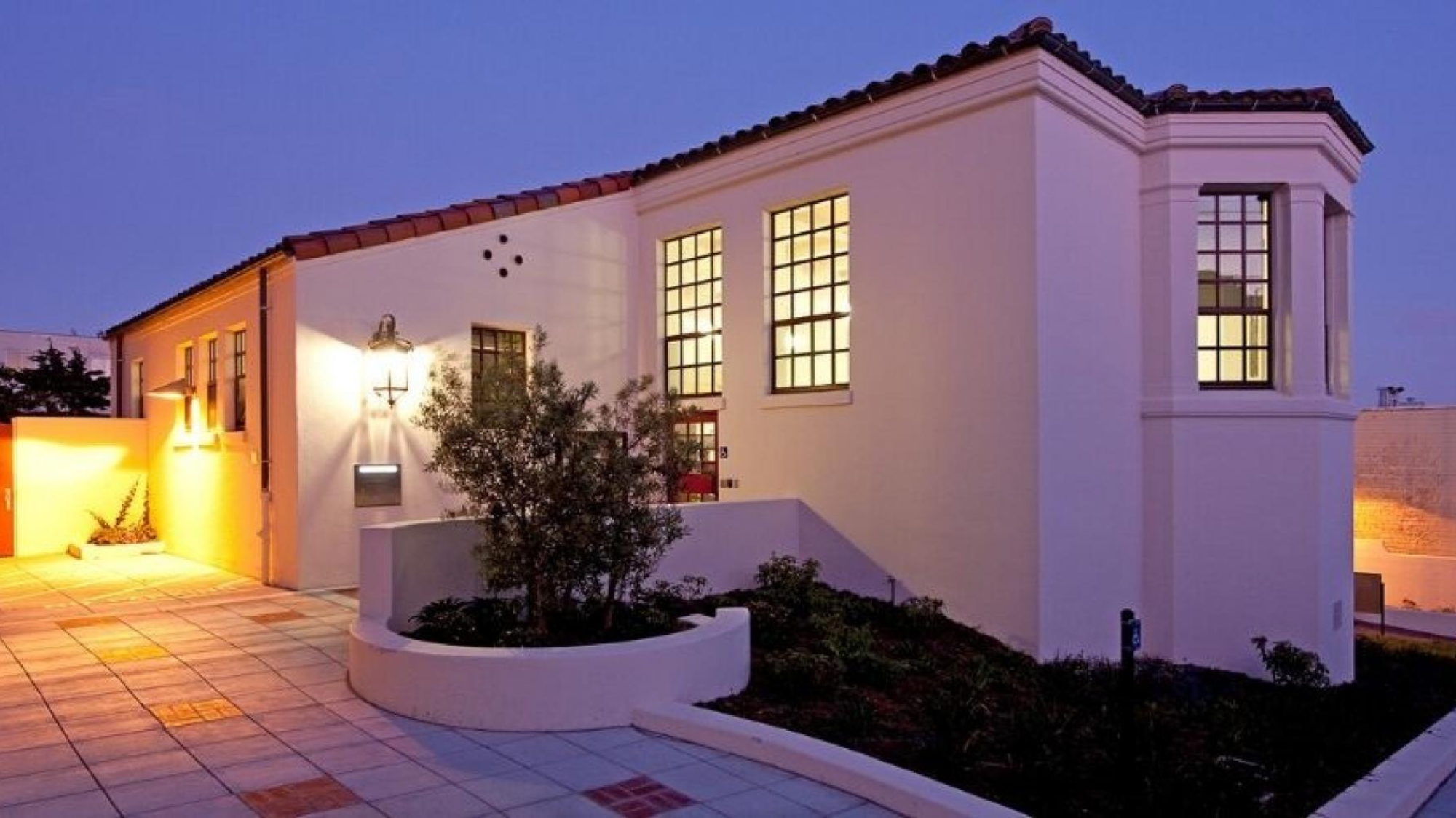 Photo of Anza Branch Library building at dusk.