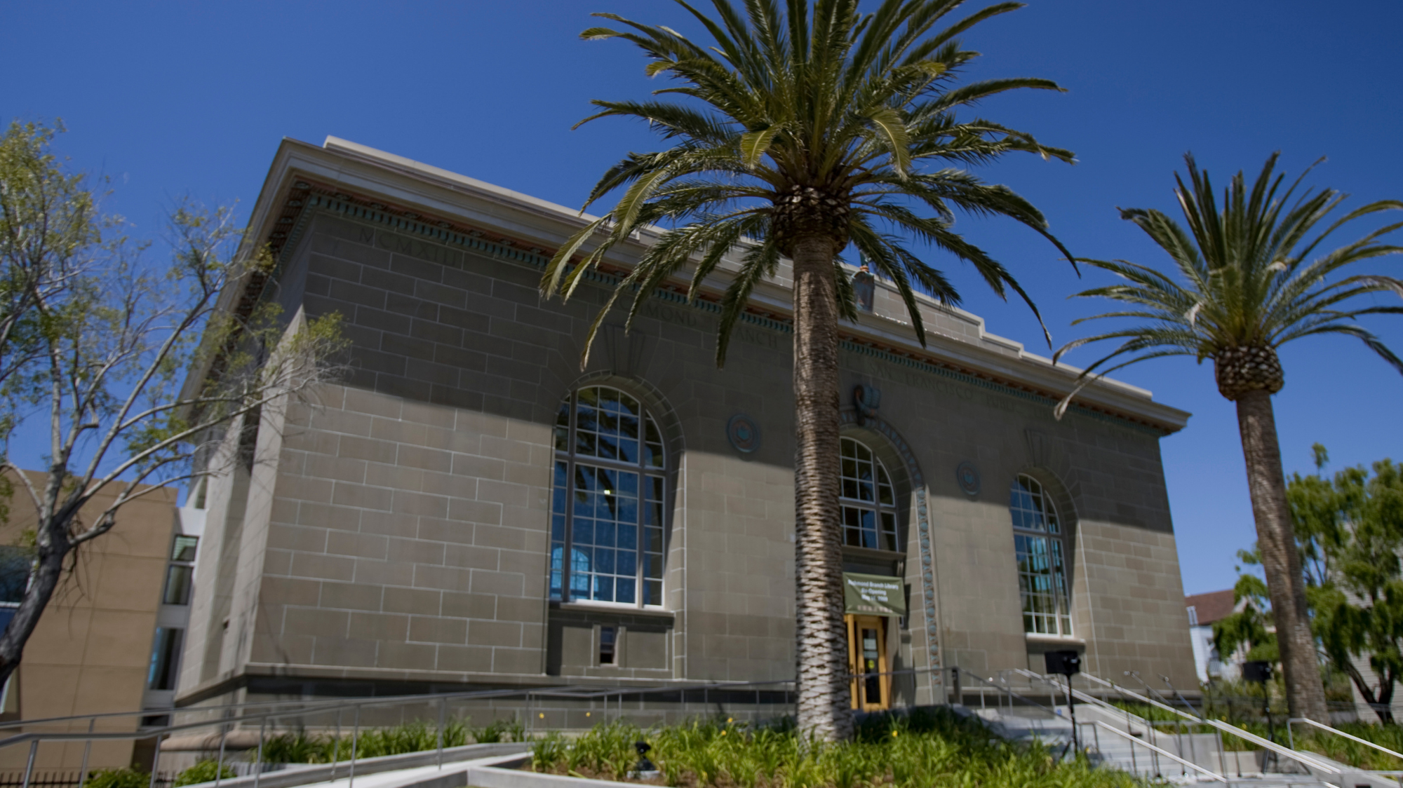 Richmond Branch Library building with palm trees.